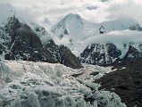 
The next morning we started our trek to Gasherbrum base camp in mostly cloudy weather. After 30 minutes we reached Gasherbrum Corner at the junction of the Upper Baltoro Glacier with the tributary Abruzzi Glacier. Gasherbrum I and Gasherbrum I South lie straight ahead. Gasherbrum I (8080m) is the 11th highest mountain in the world. Gasherbrum I was first climbed by July 5, 1958 by Americans Pete Schoening and Andy Kauffman.
